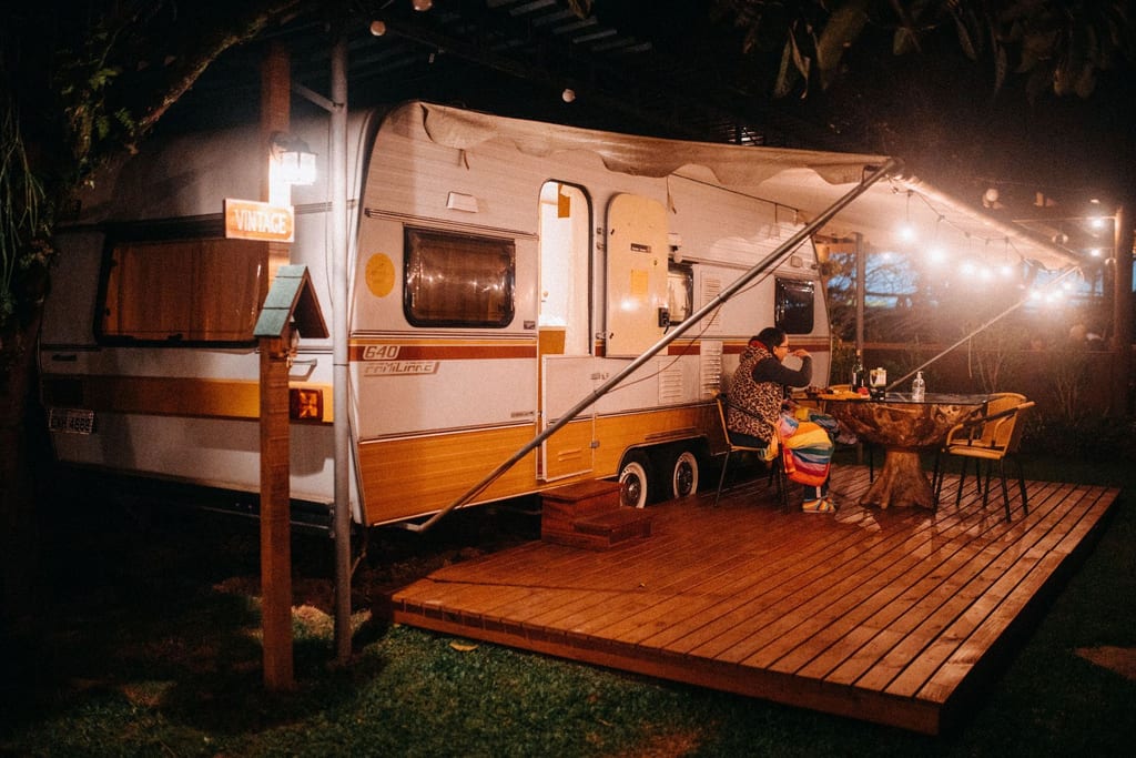 The interior of a recreational vehicle with the dinette and galley in view.